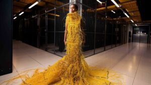 Read more about the article ‘Somewhat robot, somewhat human’: designer used 12,000ft fiber optic cable to weave a striking 50lb dress that will turn heads – and no, you can’t buy it