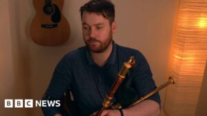 Read more about the article Strabane piper scores TV touchdown with advert